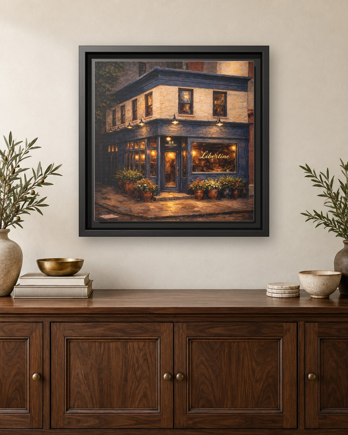 Libertine framed canvas print hanging above a credenza