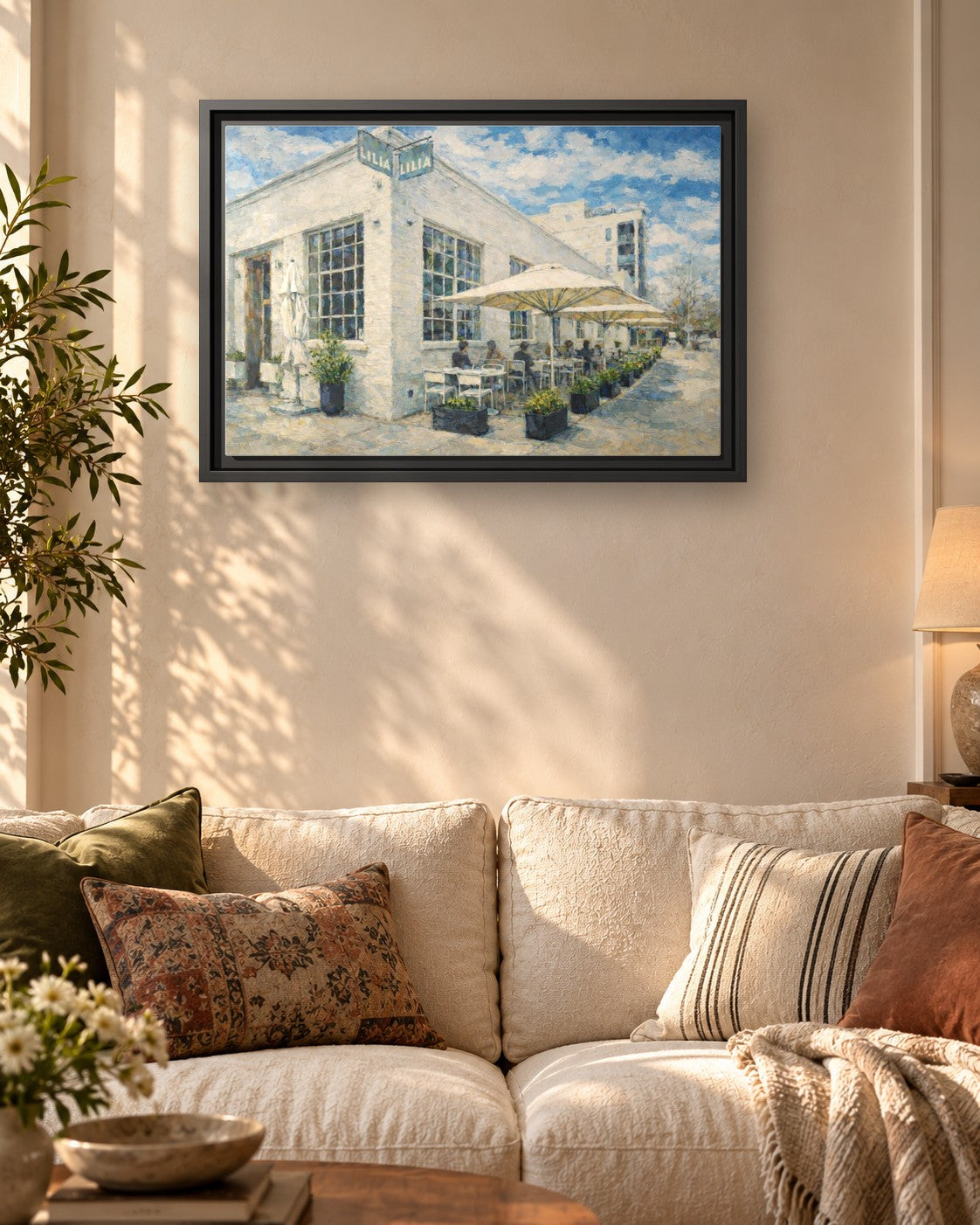 Lilia framed canvas print hanging above a sofa