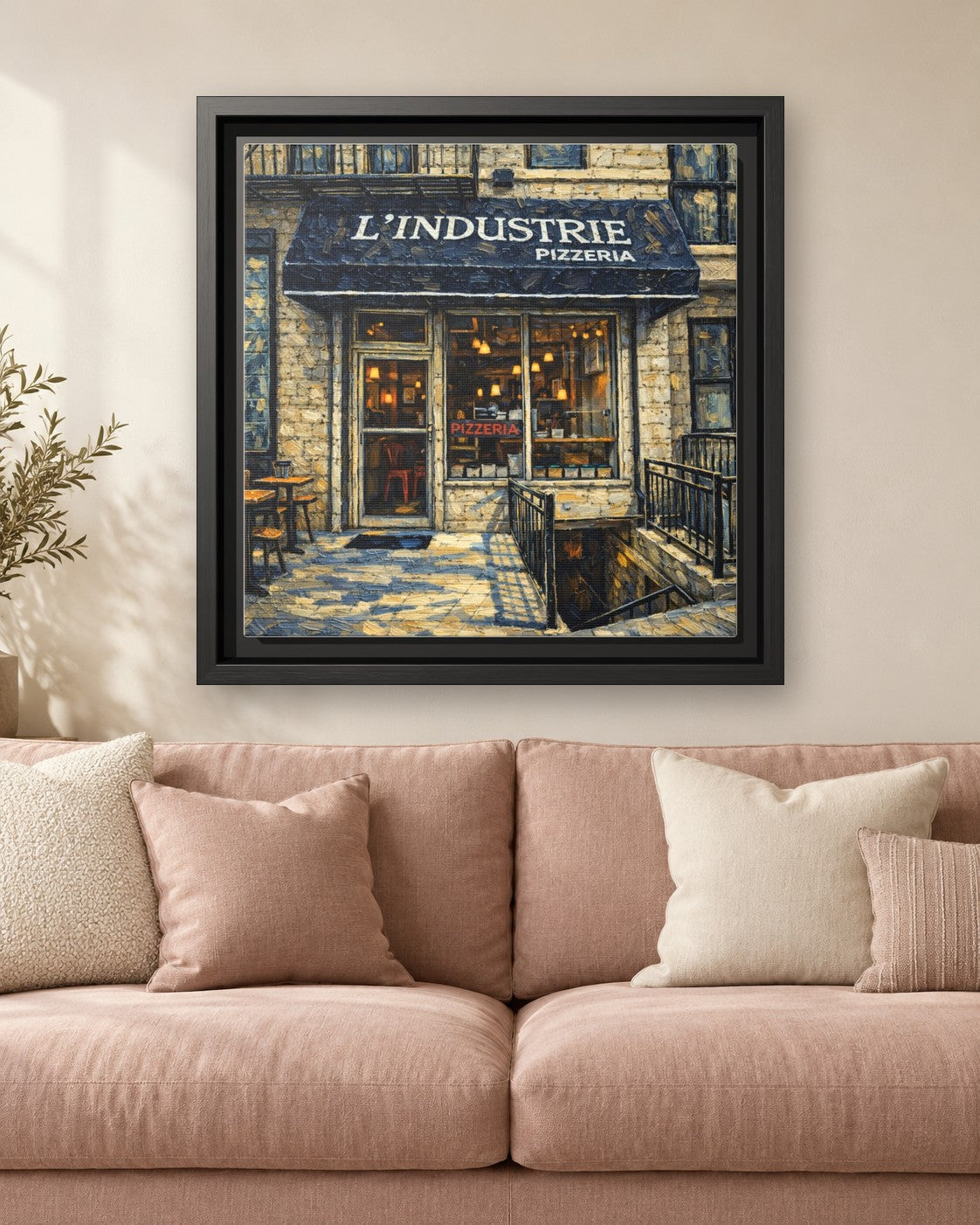 L'industrie Pizza framed canvas print hanging above a sofa