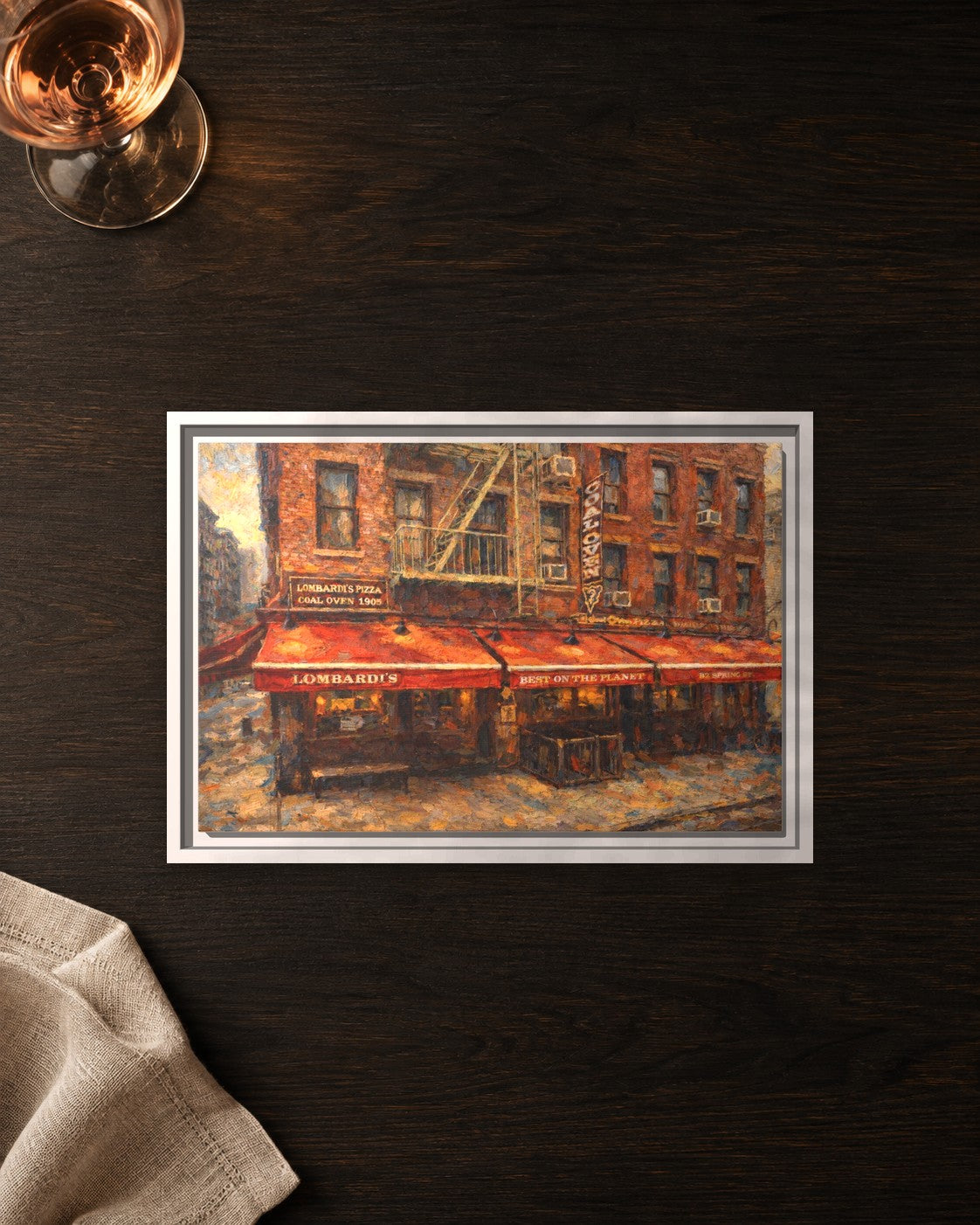 Lombardi's Pizza framed canvas print lying on a table