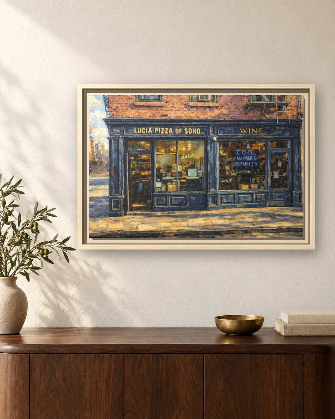 Lucia Pizza of Soho framed canvas print hanging above a sideboard