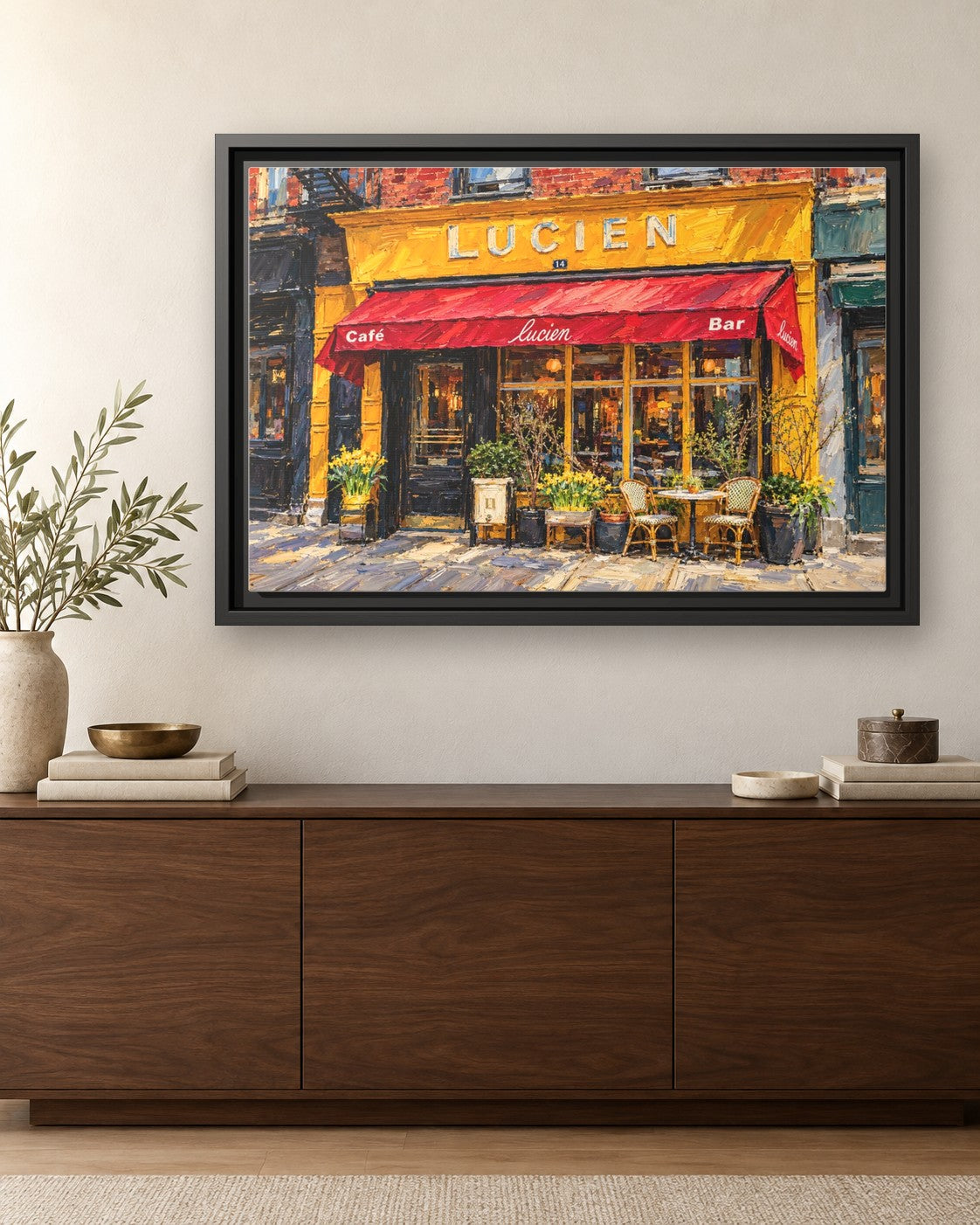 Lucien's framed canvas print hanging above a credenza