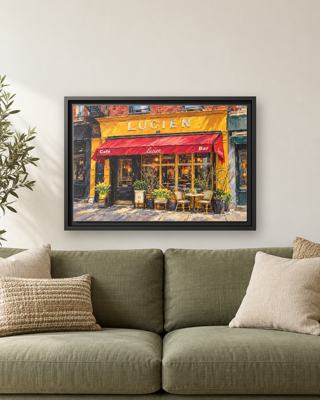 Lucien's framed canvas print hanging above a sofa