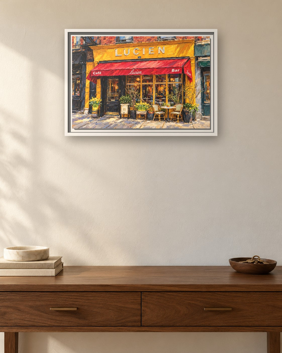 Lucien's framed canvas print hanging above a sideboard