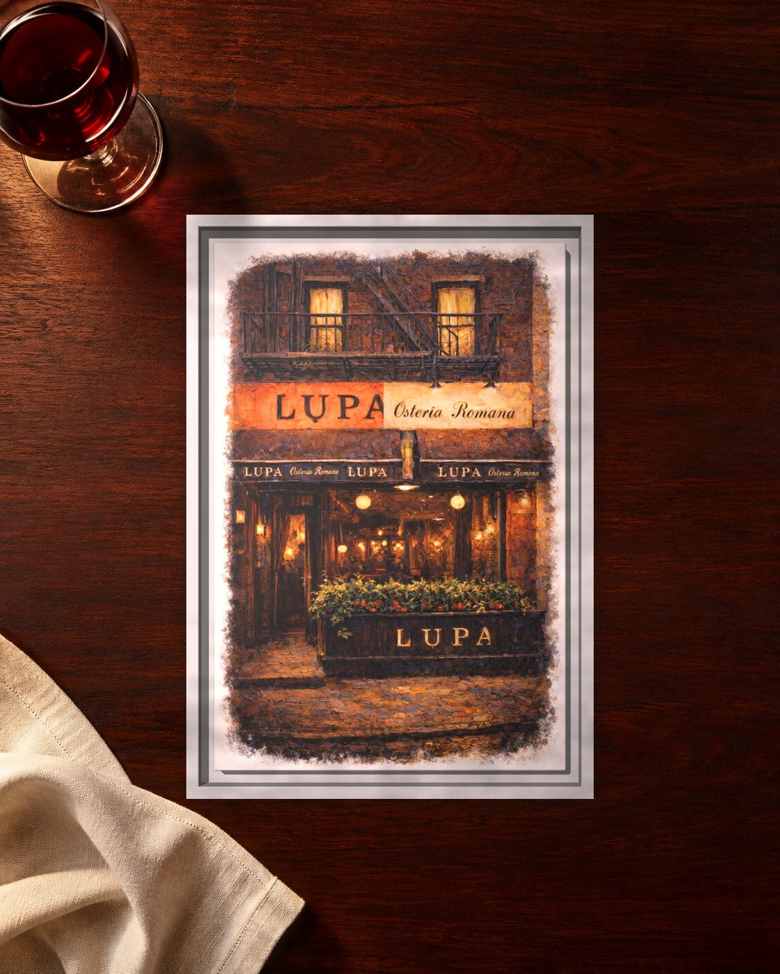 Lupa Osteria Romana framed canvas print lying on a table