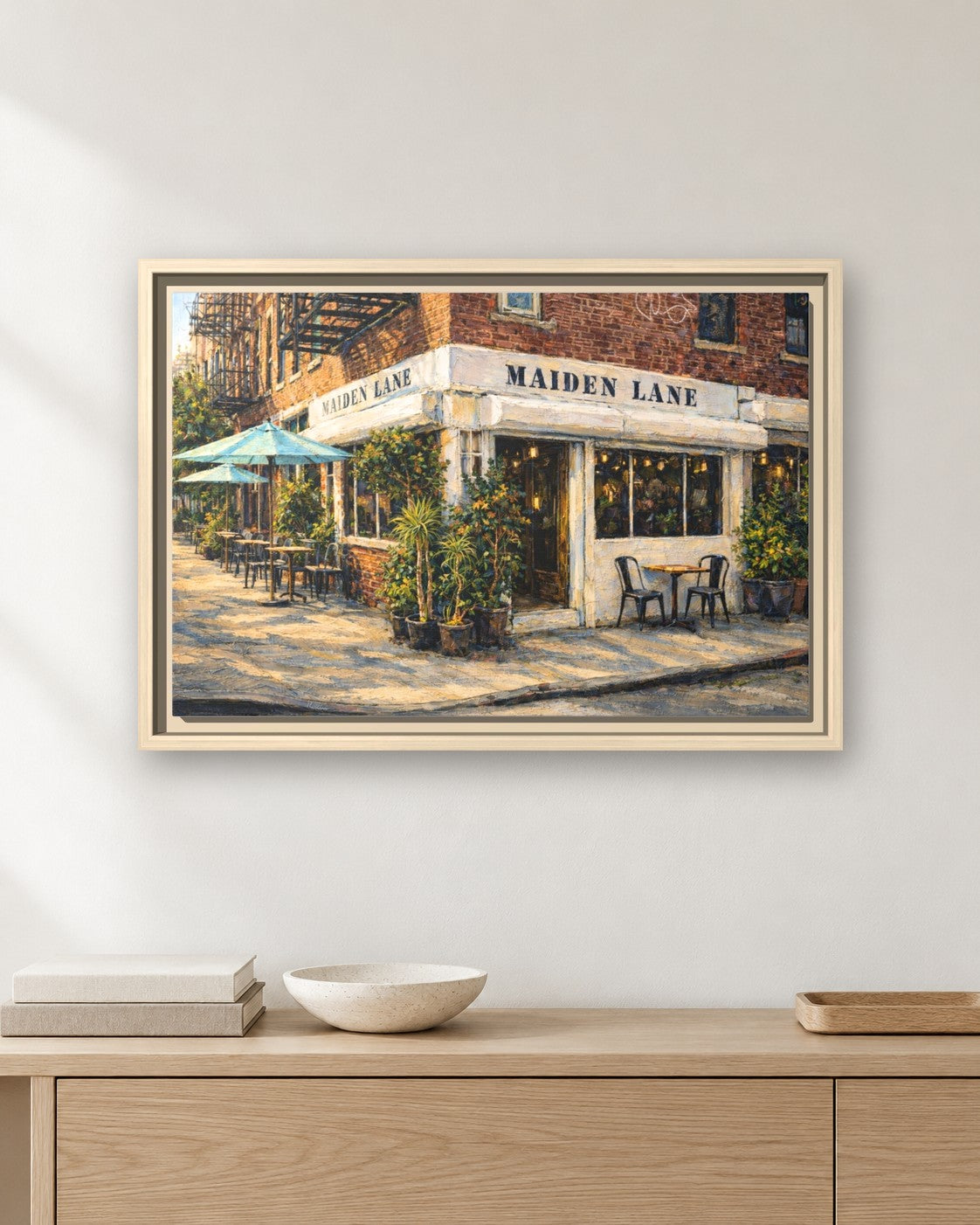 Maiden Lane framed canvas print hanging above a sideboard