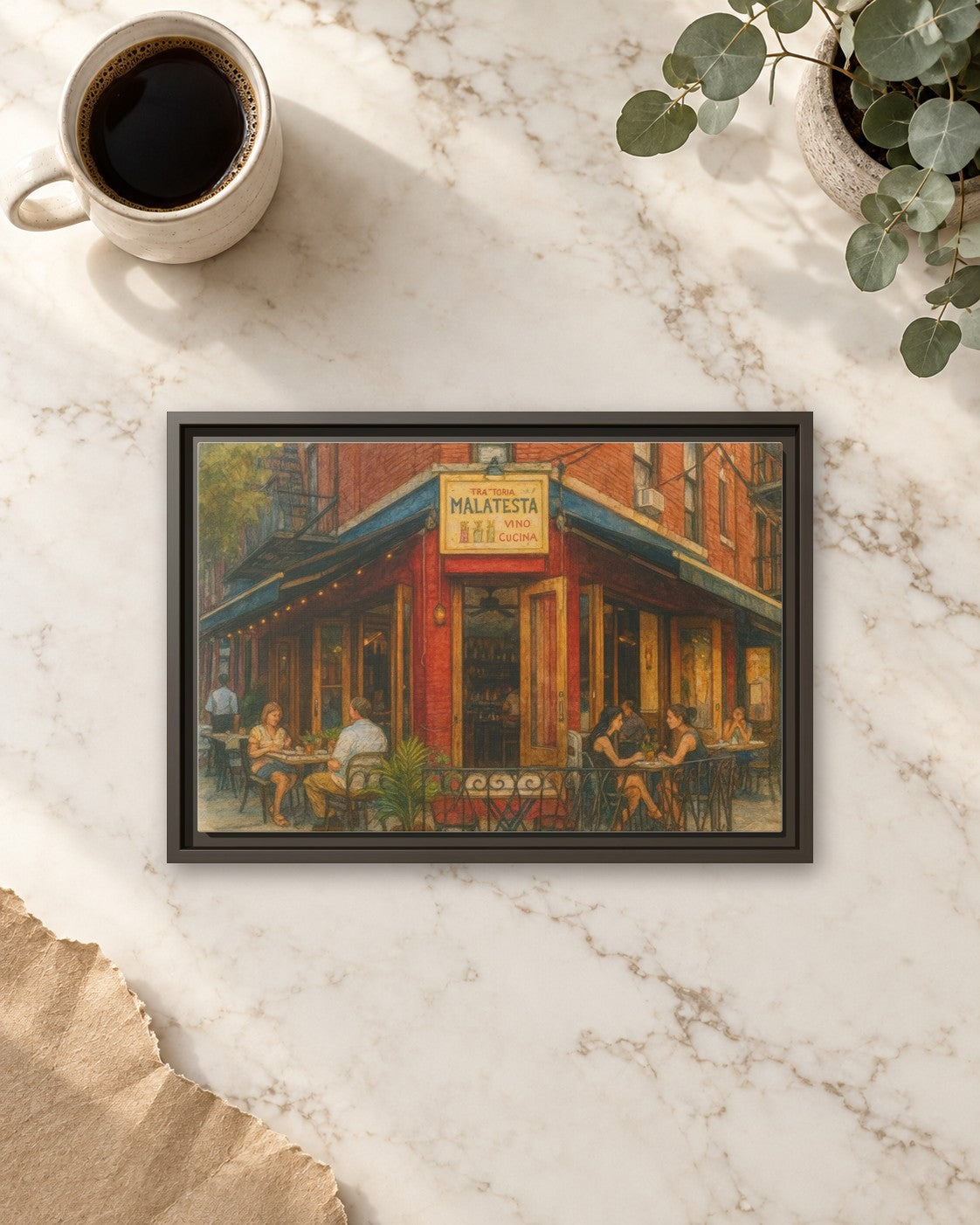 Malatesta Trattoria framed canvas print lying on a table