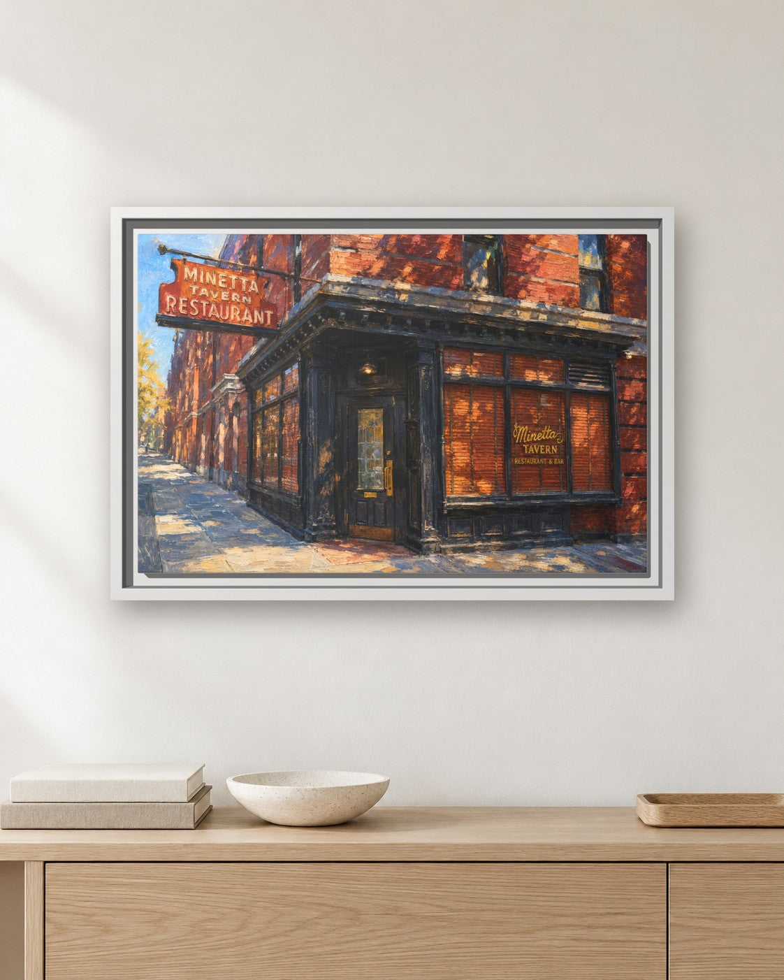 Minetta Tavern framed canvas print hanging above a sideboard