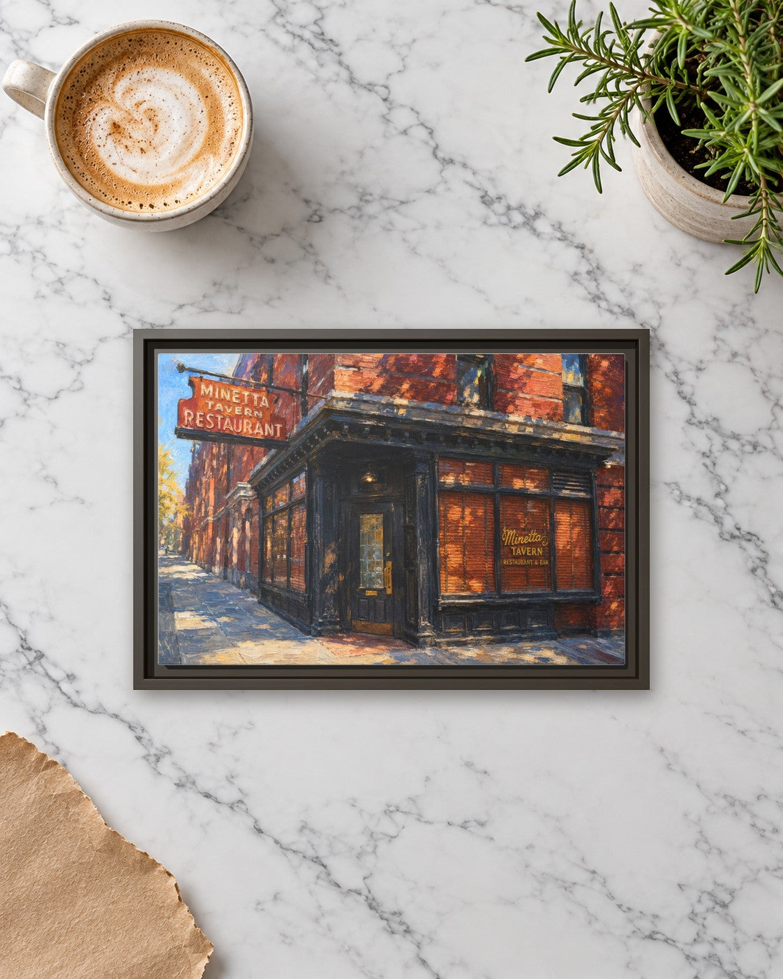 Minetta Tavern framed canvas print lying on a table