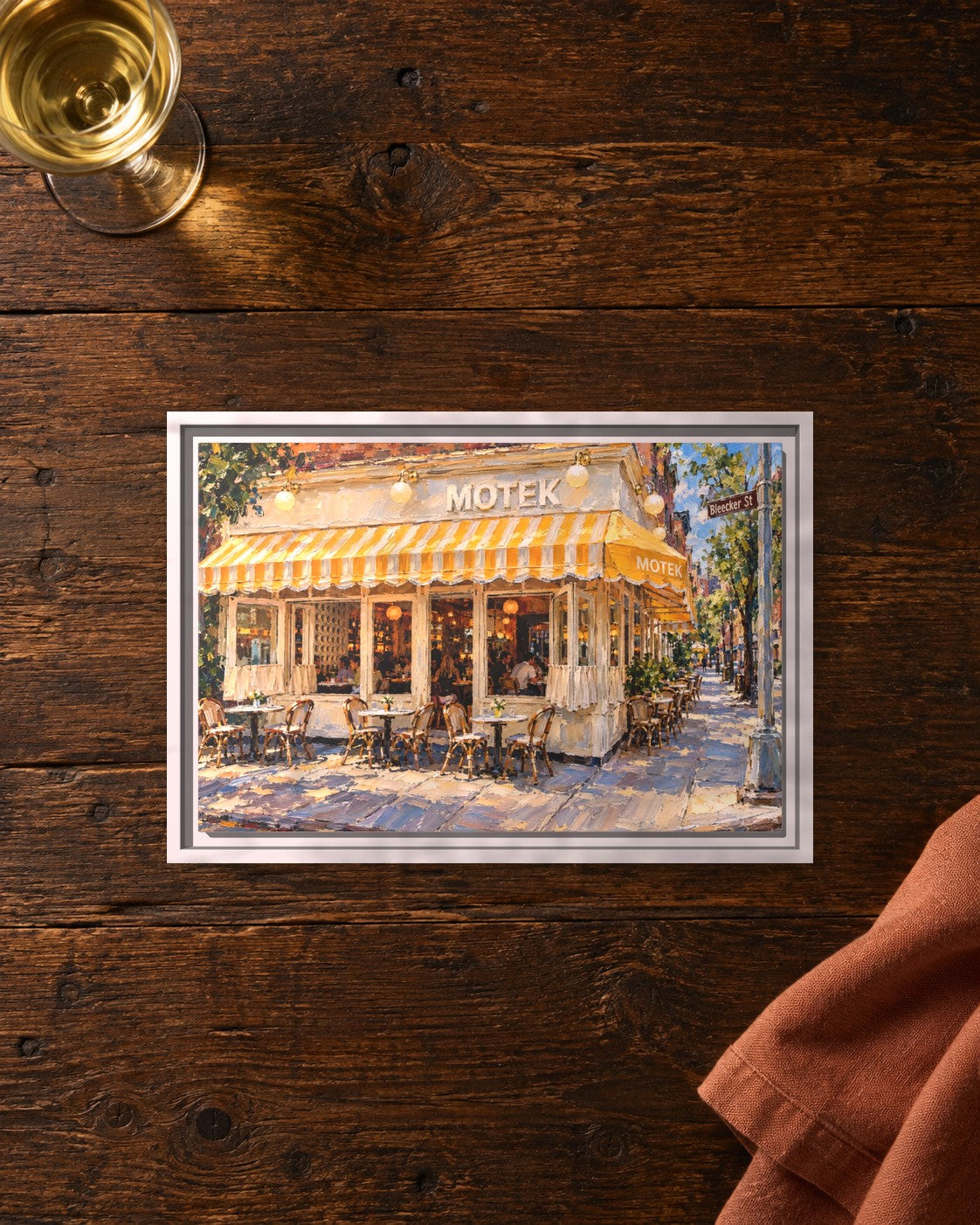 Motek West Village framed canvas print lying on a table