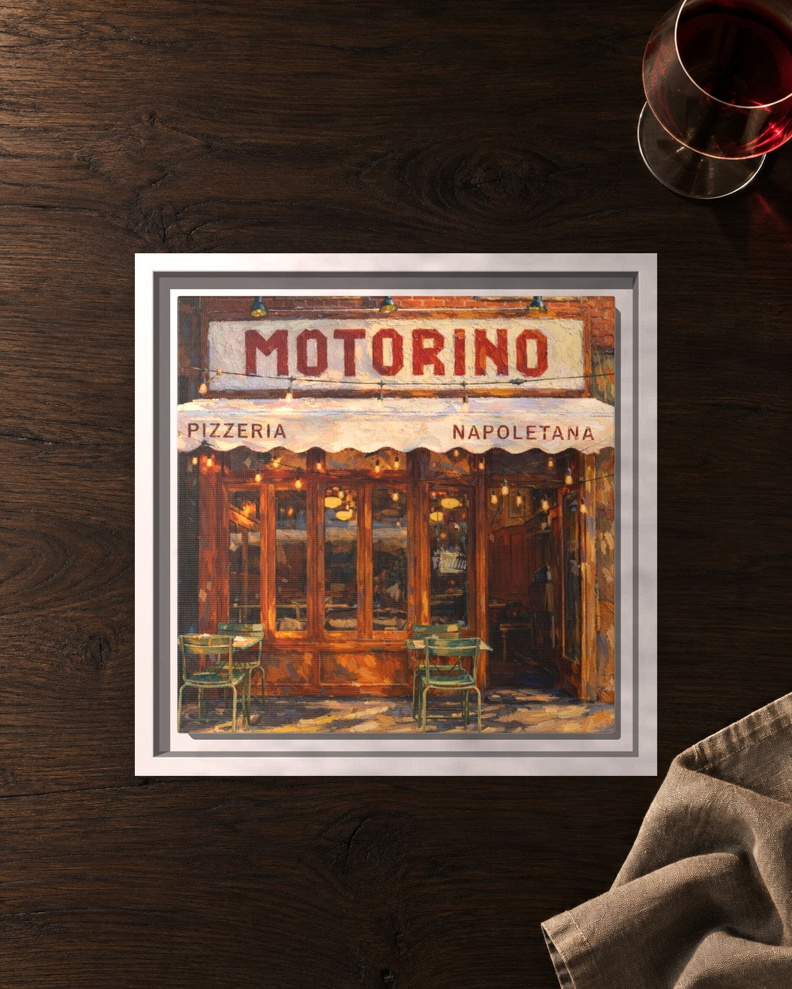 Motorino framed canvas print lying on a table