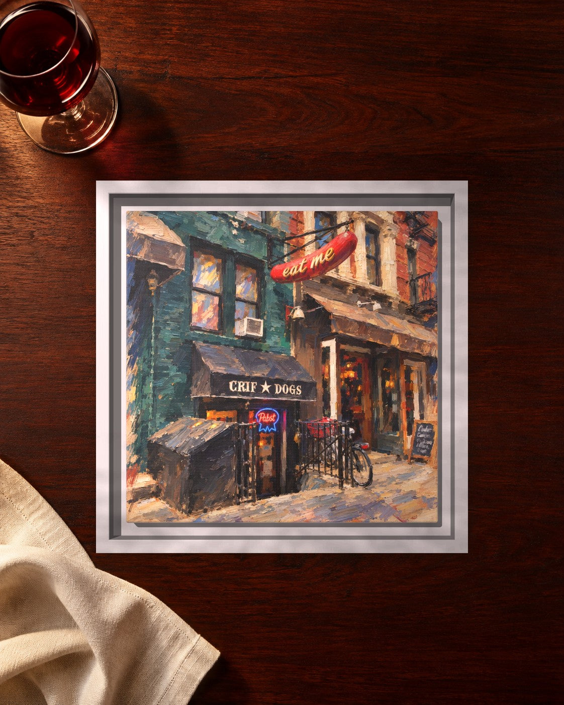 Please Don't Tell (PDT) framed canvas print lying on a table