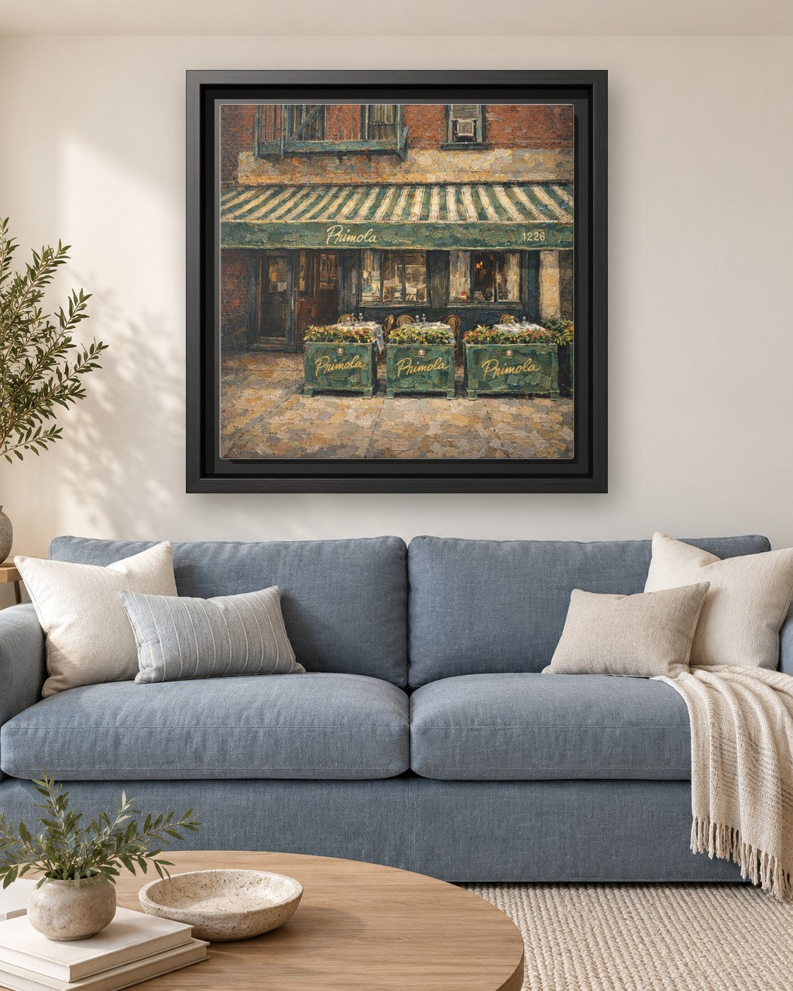 Primola framed canvas print hanging above a sofa