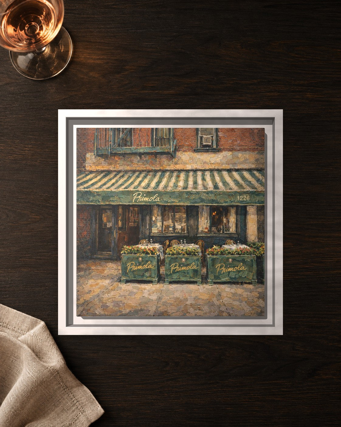 Primola framed canvas print lying on a table