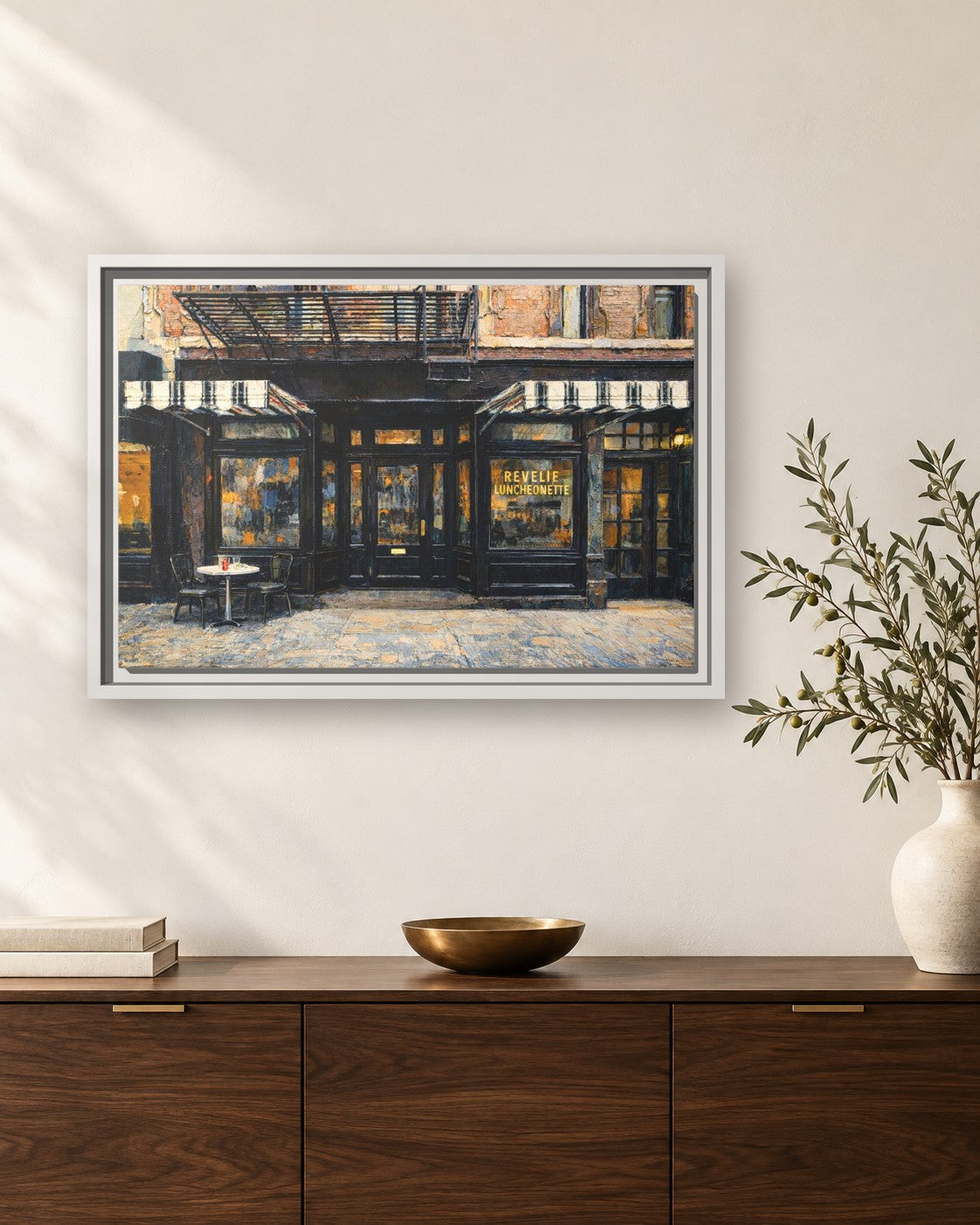 Revelie Luncheonette framed canvas print hanging above a sideboard