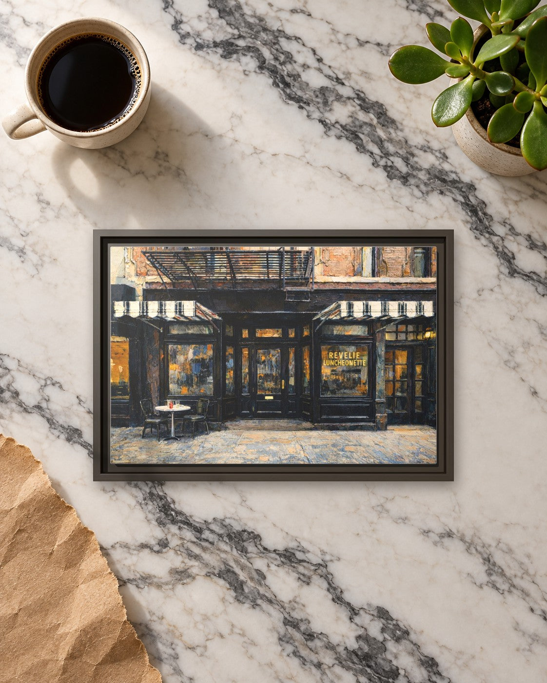 Revelie Luncheonette framed canvas print lying on a table