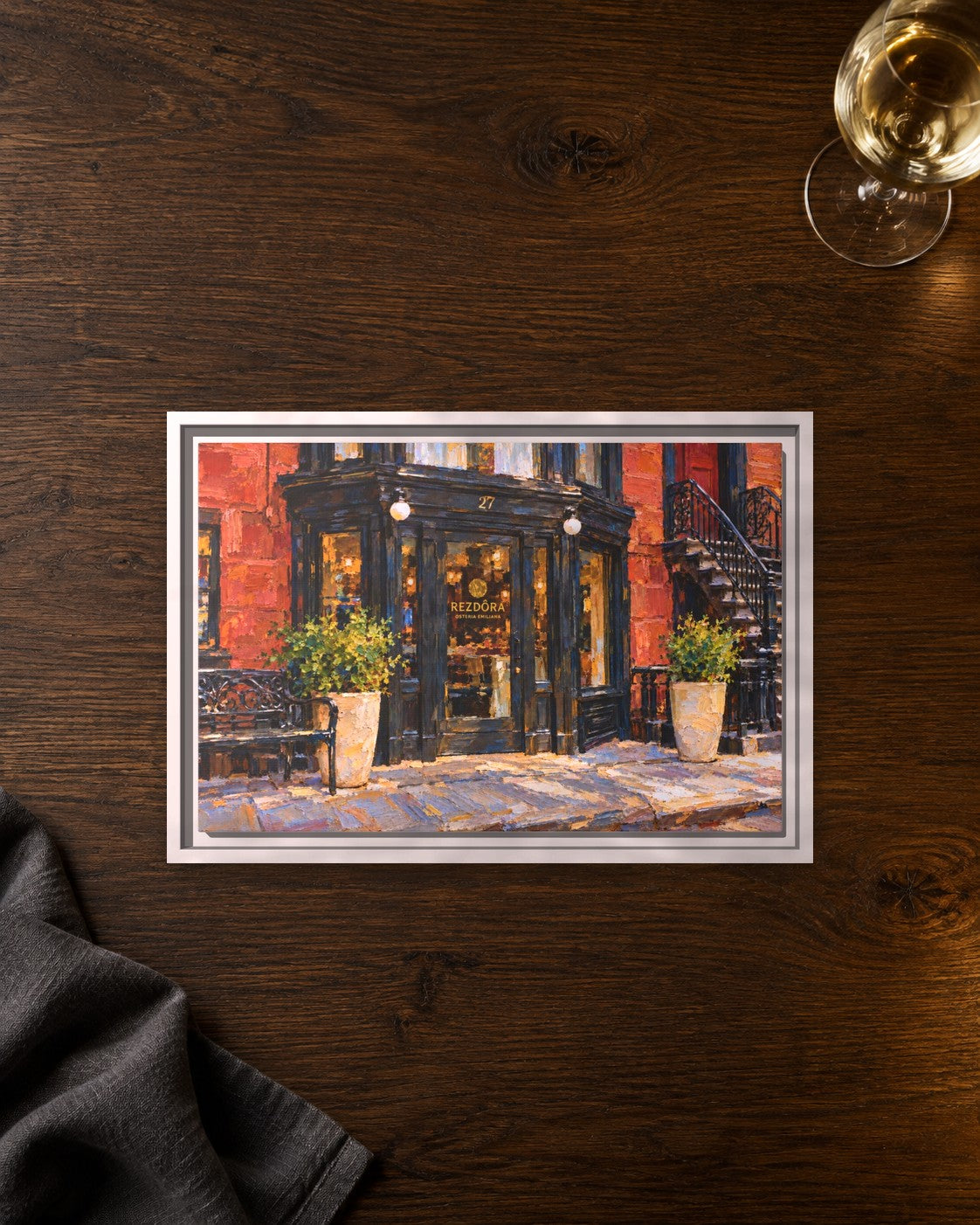 Rezdora framed canvas print lying on a table