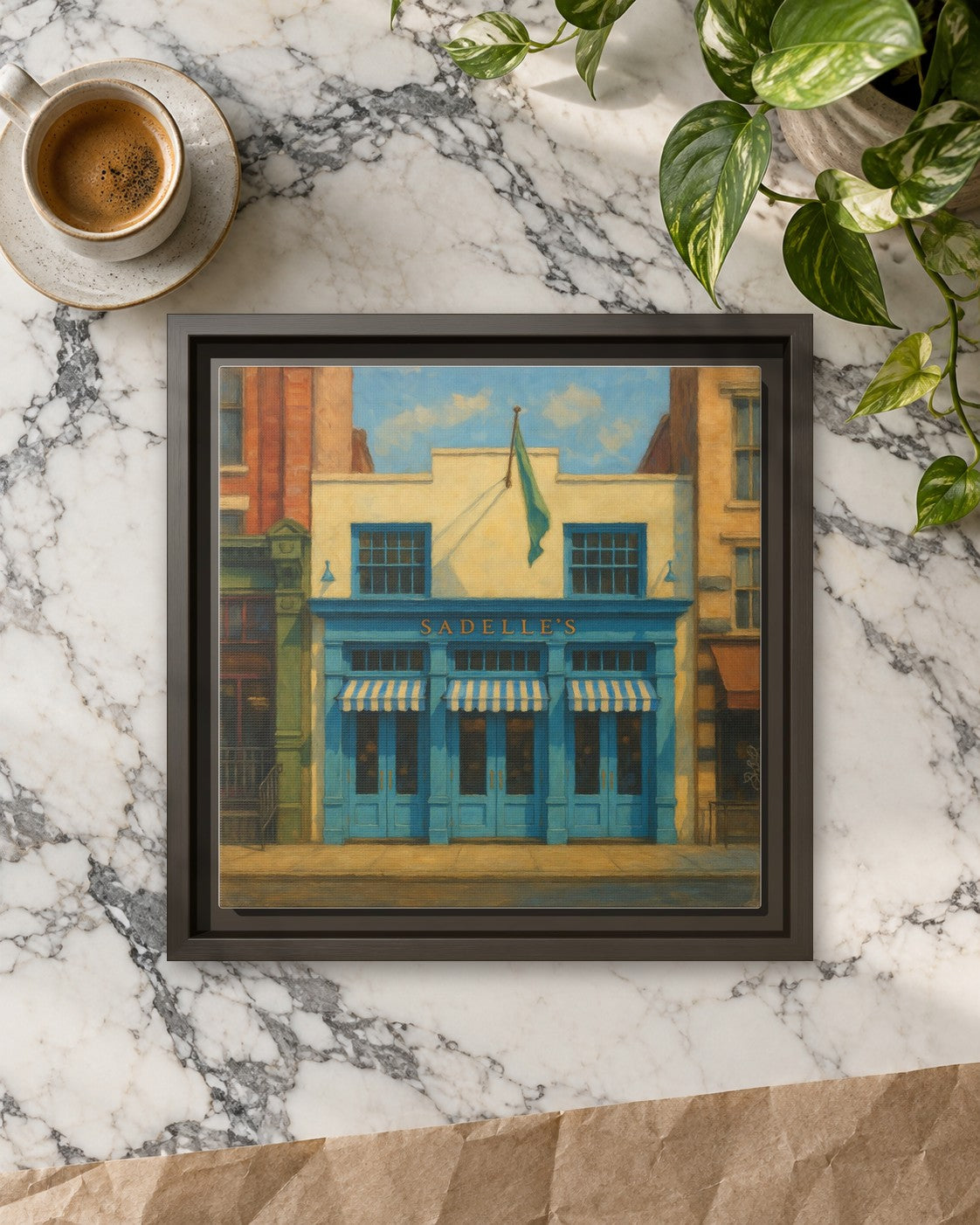 Sadelle's Restaurant framed canvas print lying on a table
