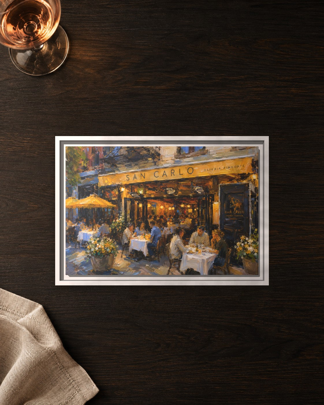 San Carlo Osteria Piemonte framed canvas print lying on a table