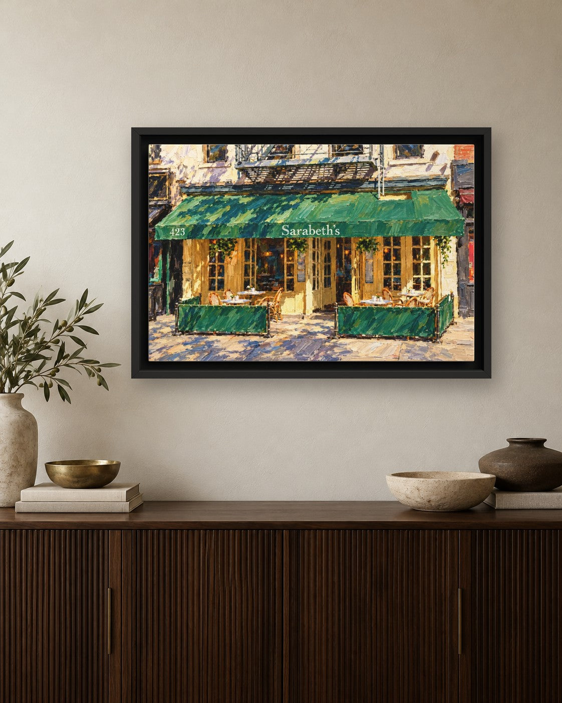 Sarabeth's framed canvas print hanging above a credenza