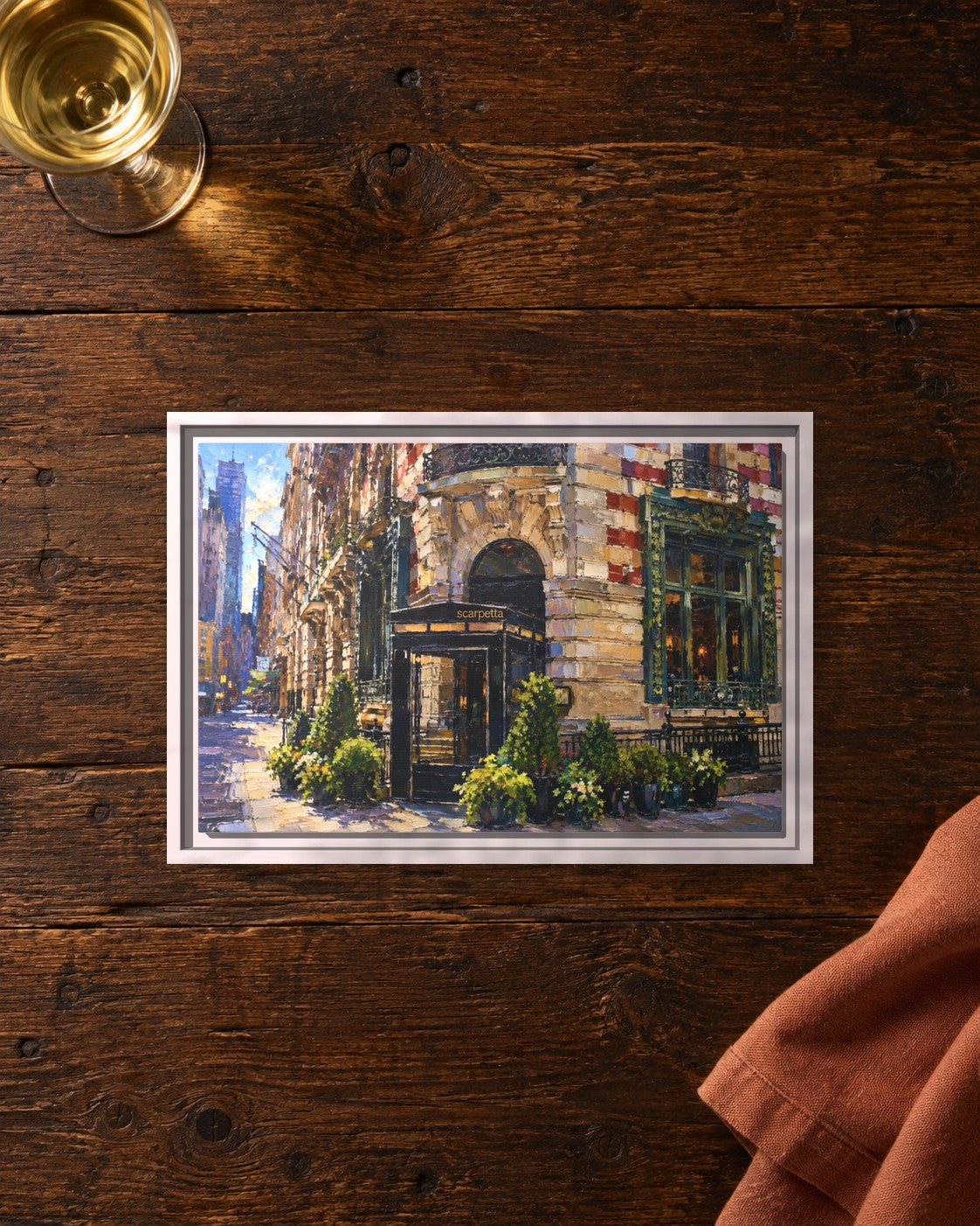 Scarpetta framed canvas print lying on a table