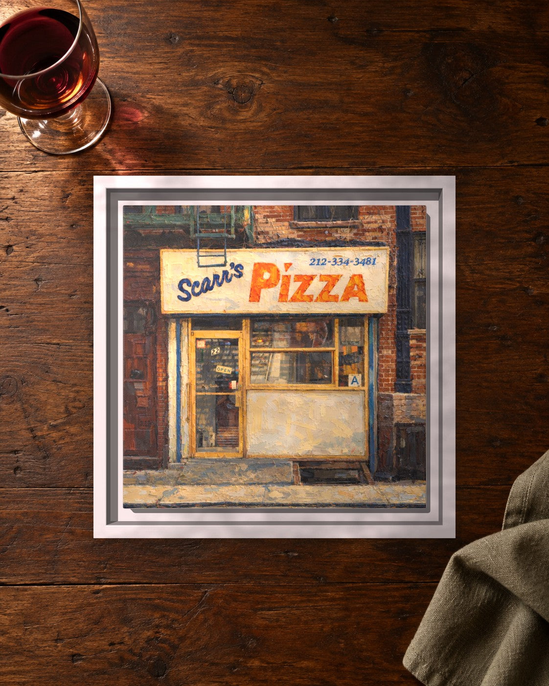 Scarr's Pizza framed canvas print lying on a table