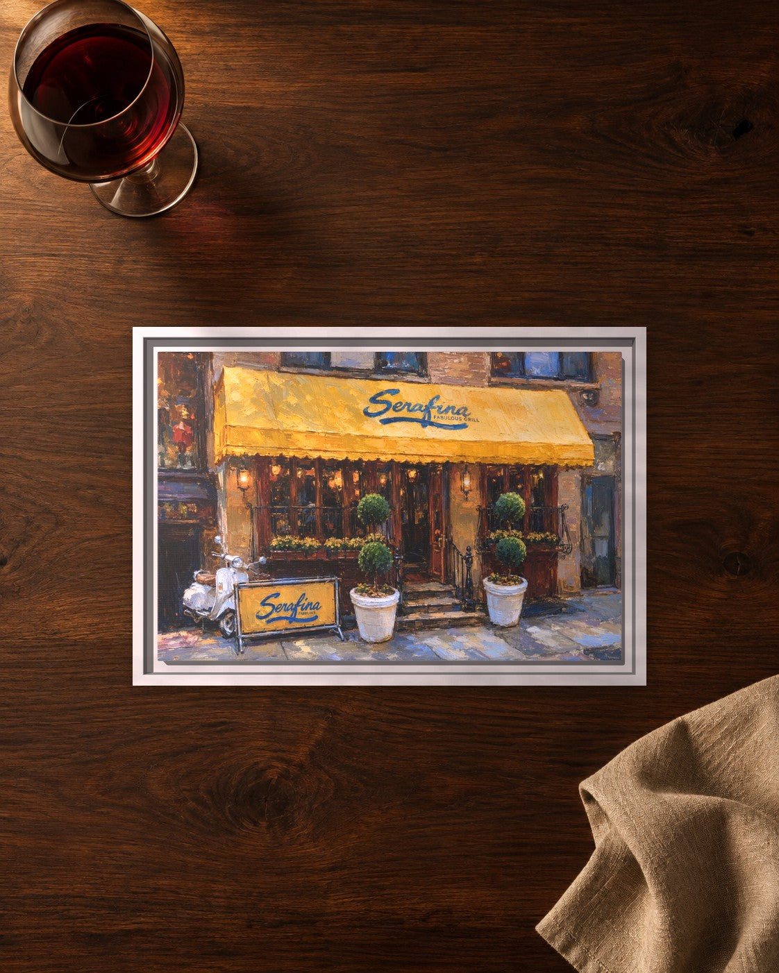 Serafina (Original Location) framed canvas print lying on a table