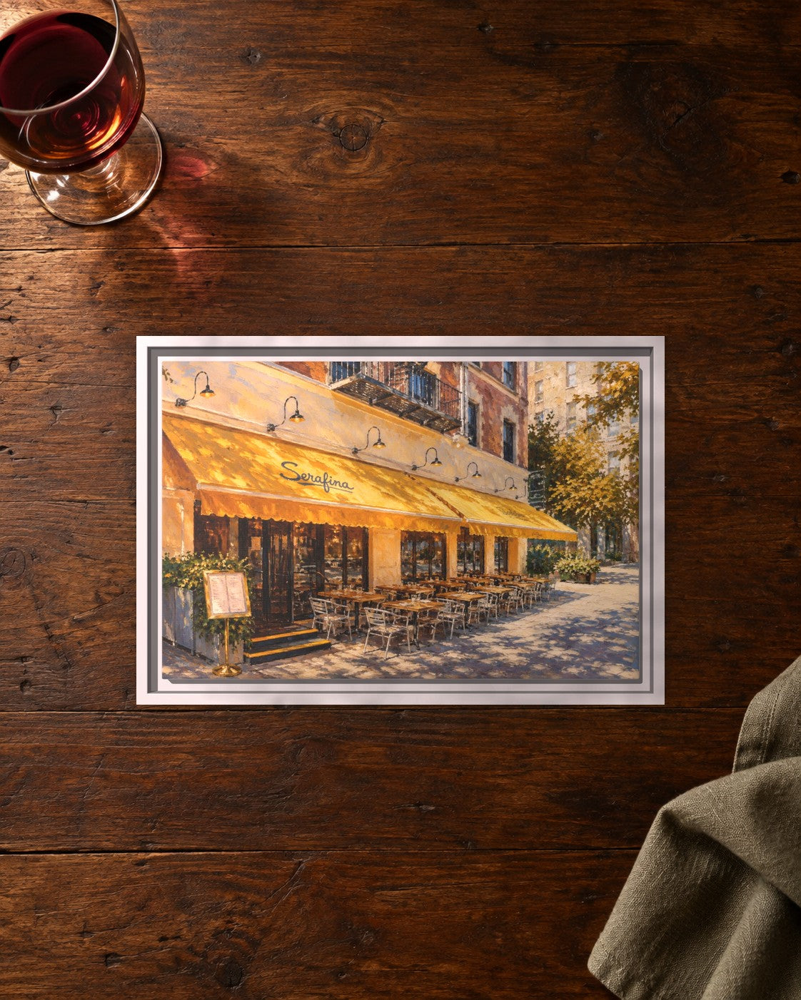 Serafina (Upper West Side) framed canvas print lying on a table