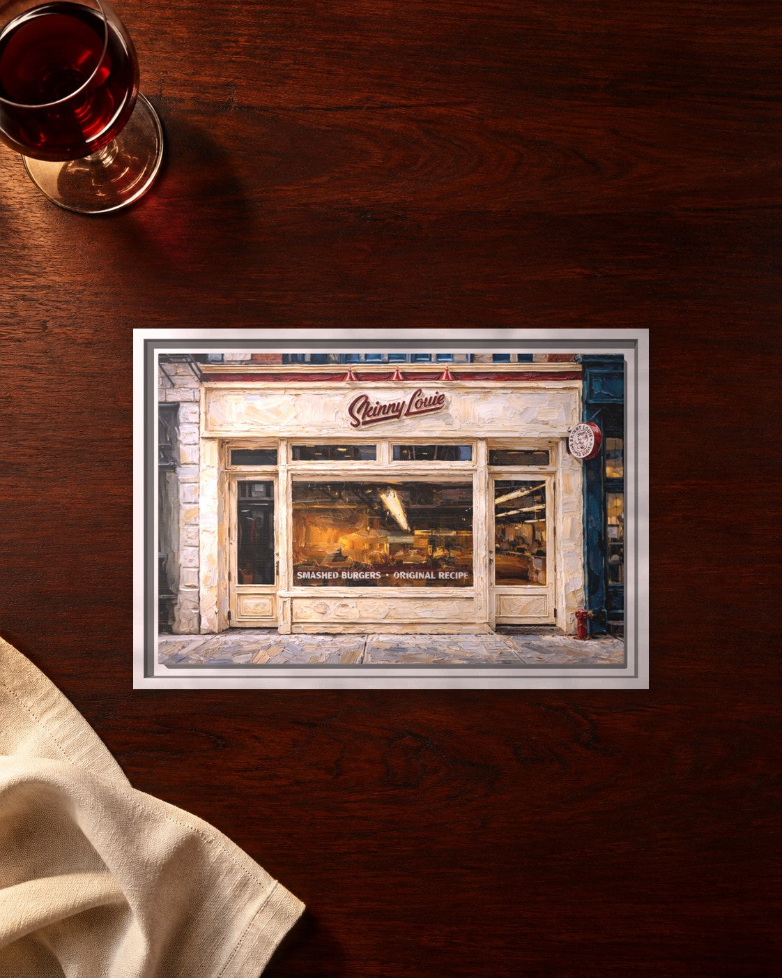Skinny Louie framed canvas print lying on a table