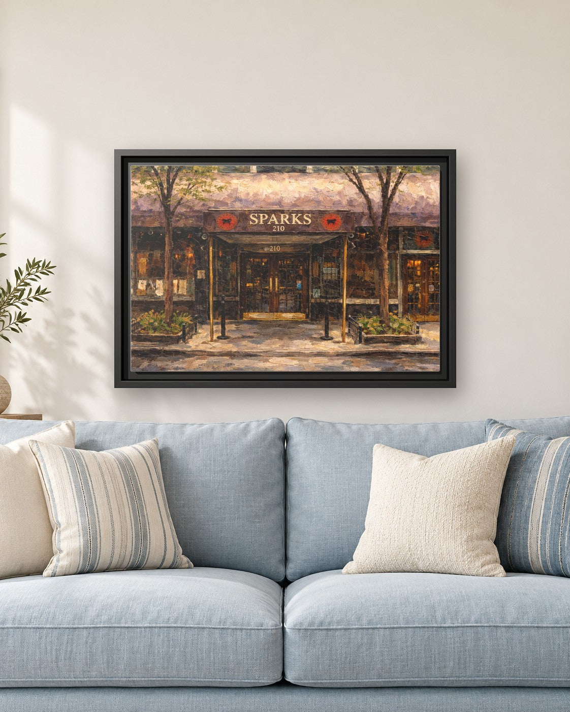 Sparks Steak House framed canvas print hanging above a sofa