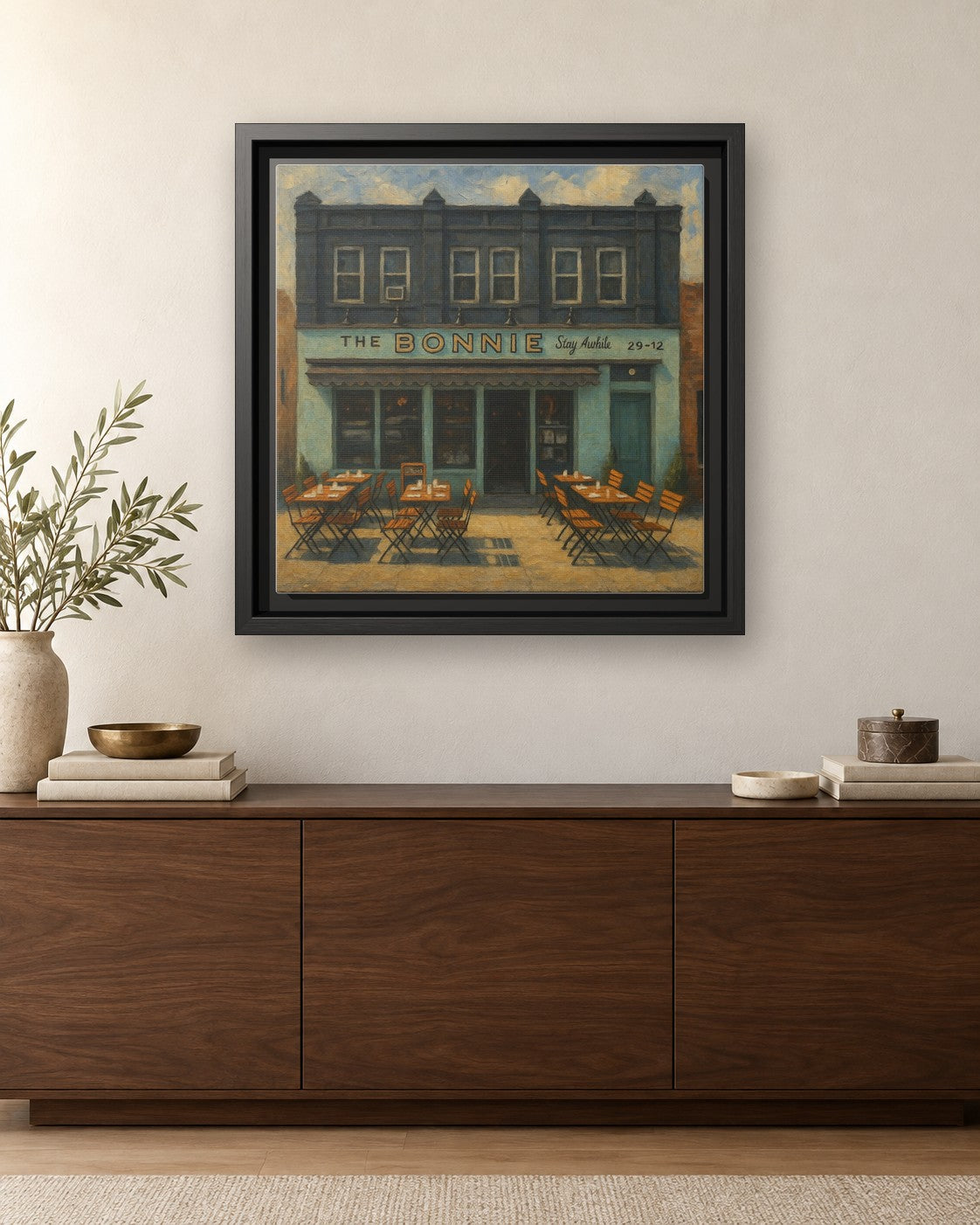 The Bonnie framed canvas print hanging above a credenza