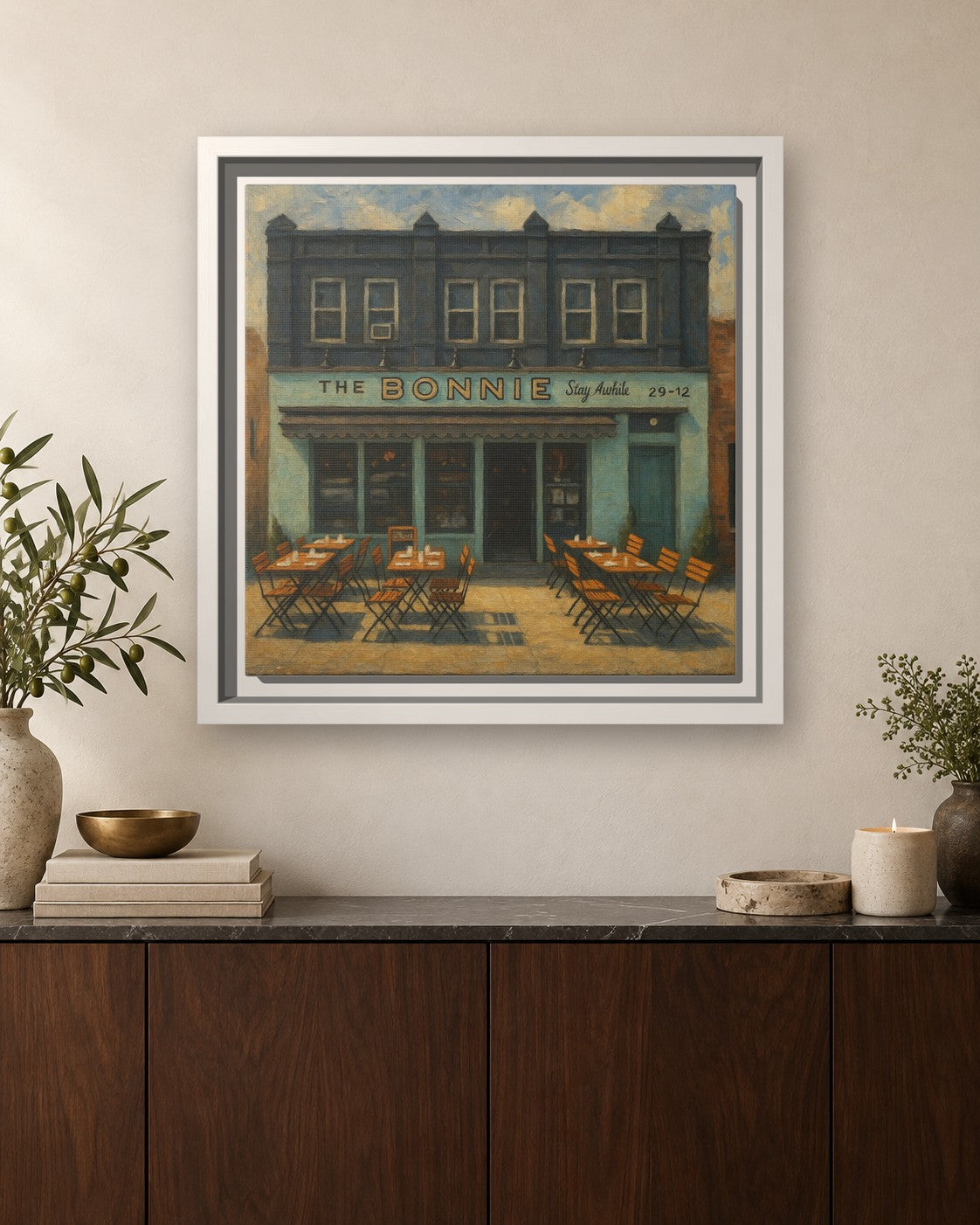 The Bonnie framed canvas print hanging above a sideboard