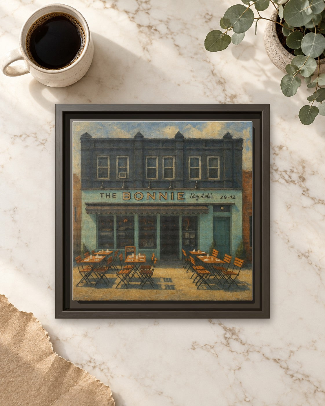 The Bonnie framed canvas print lying on a table