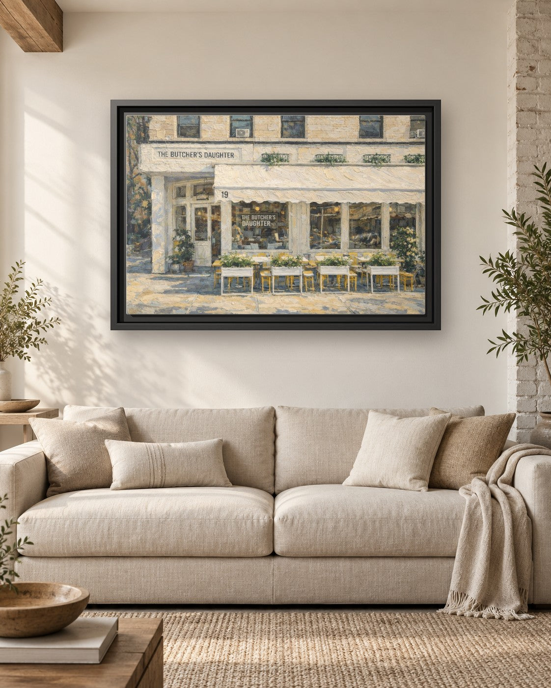 The Butcher's Daughter framed canvas print hanging above a sofa