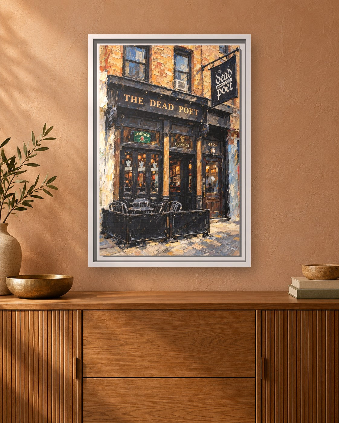 The Dead Poet framed canvas print hanging above a sideboard