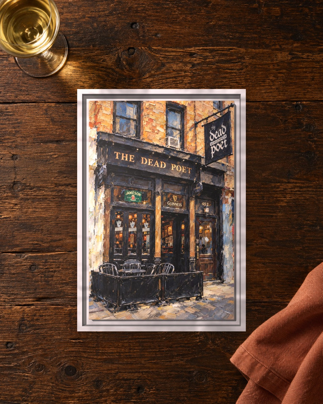 The Dead Poet framed canvas print lying on a table