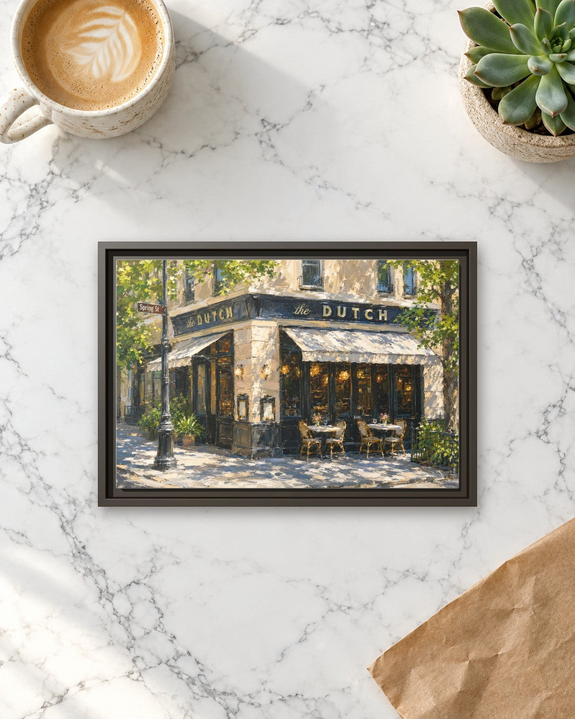 The Dutch framed canvas print lying on a table