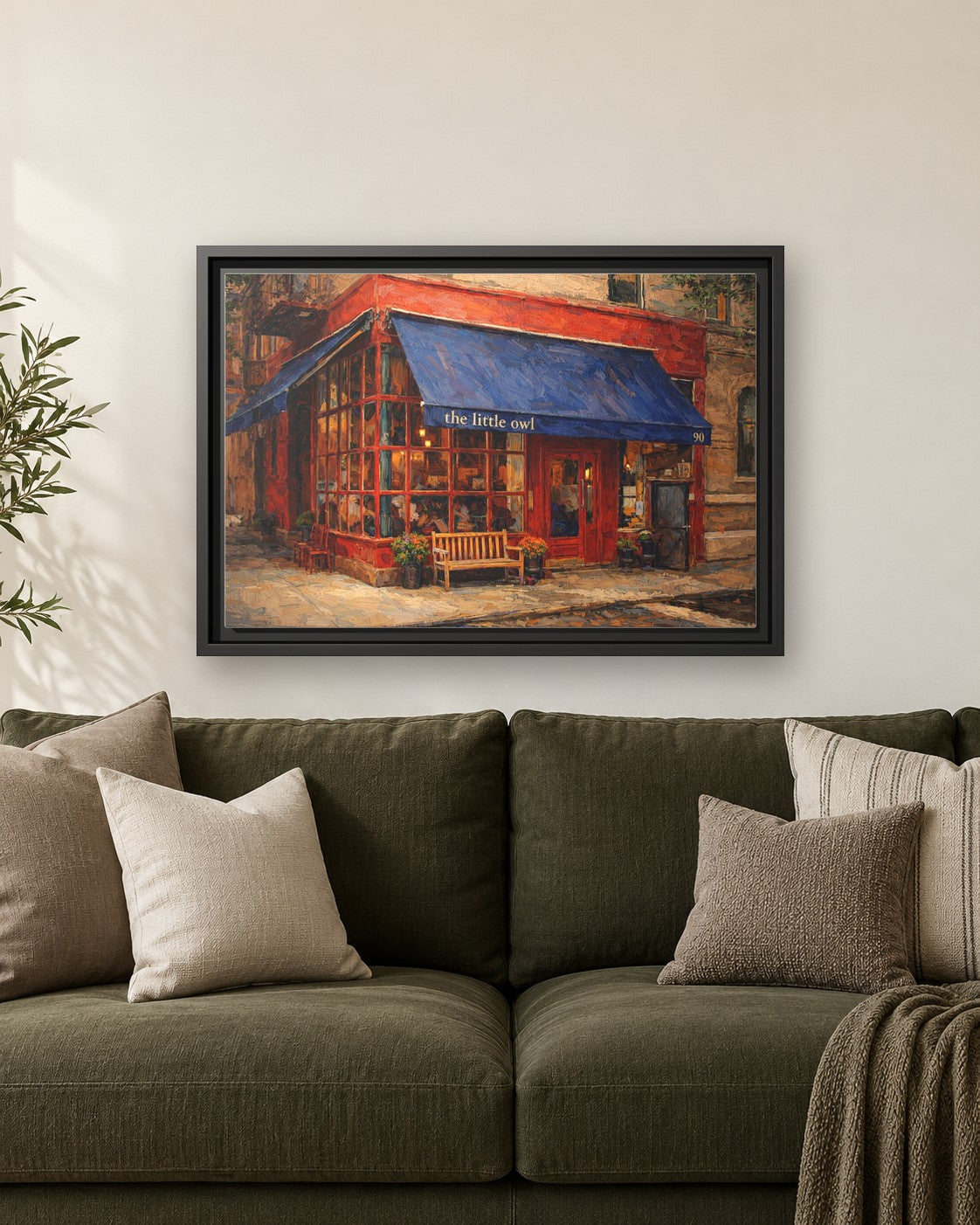 The Little Owl framed canvas print hanging above a sofa