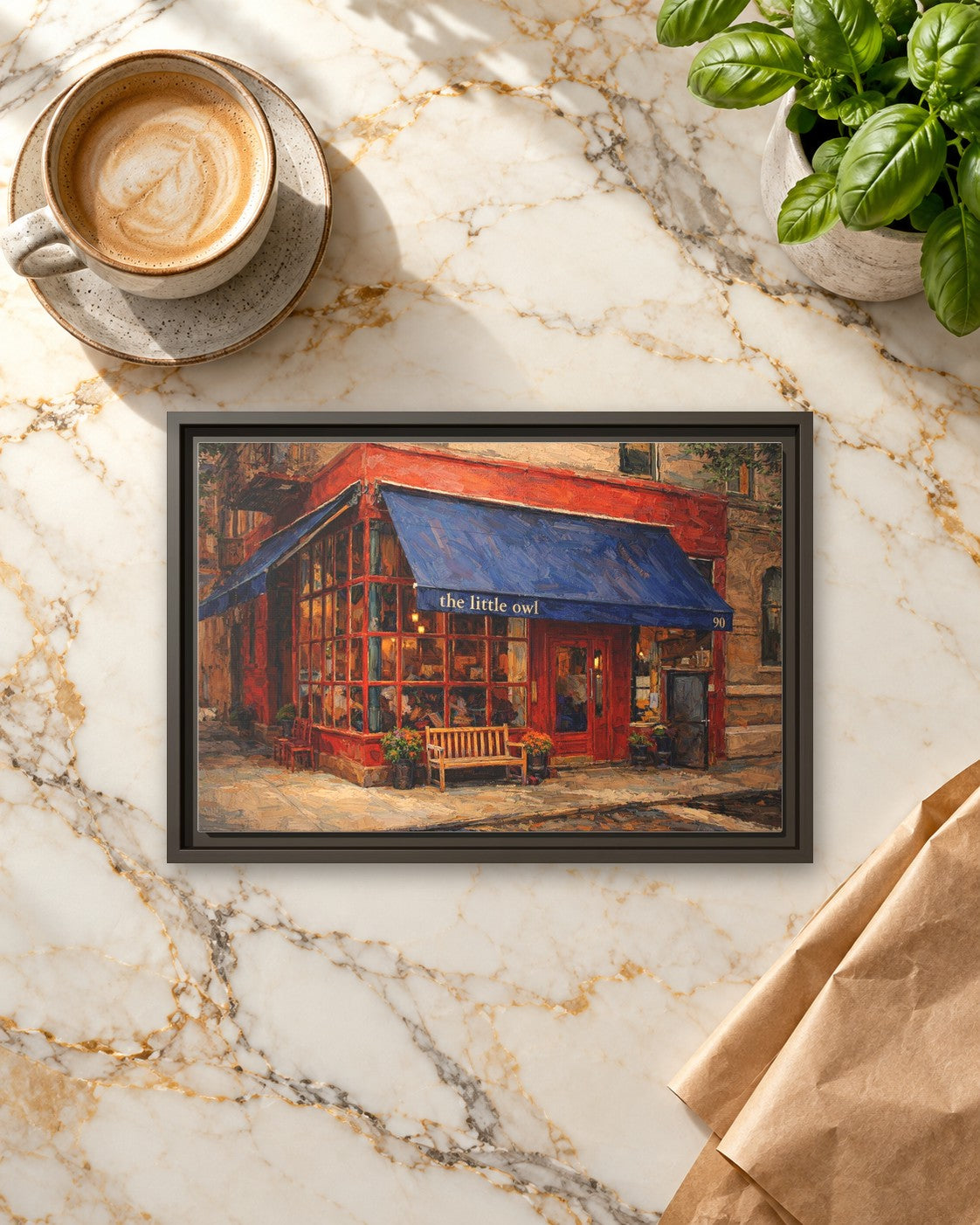 The Little Owl framed canvas print lying on a table