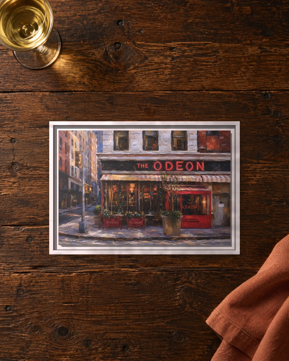 The Odeon framed canvas print lying on a table