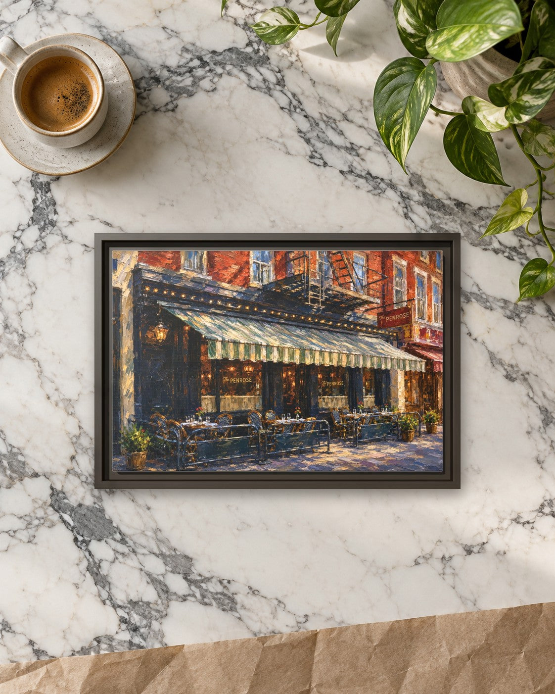 The Penrose framed canvas print lying on a table