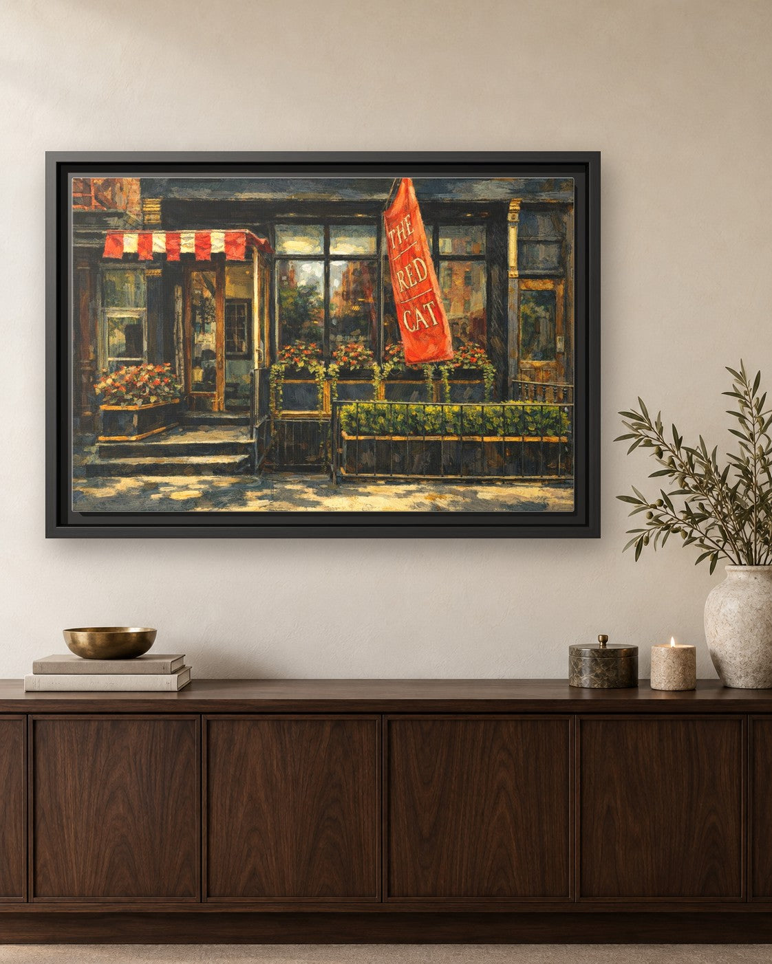 The Red Cat framed canvas print hanging above a credenza