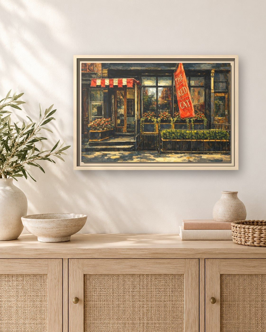 The Red Cat framed canvas print hanging above a sideboard