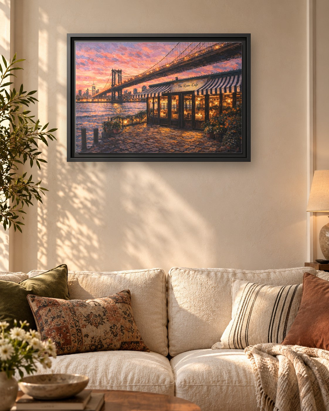 The River Cafe framed canvas print hanging above a sofa