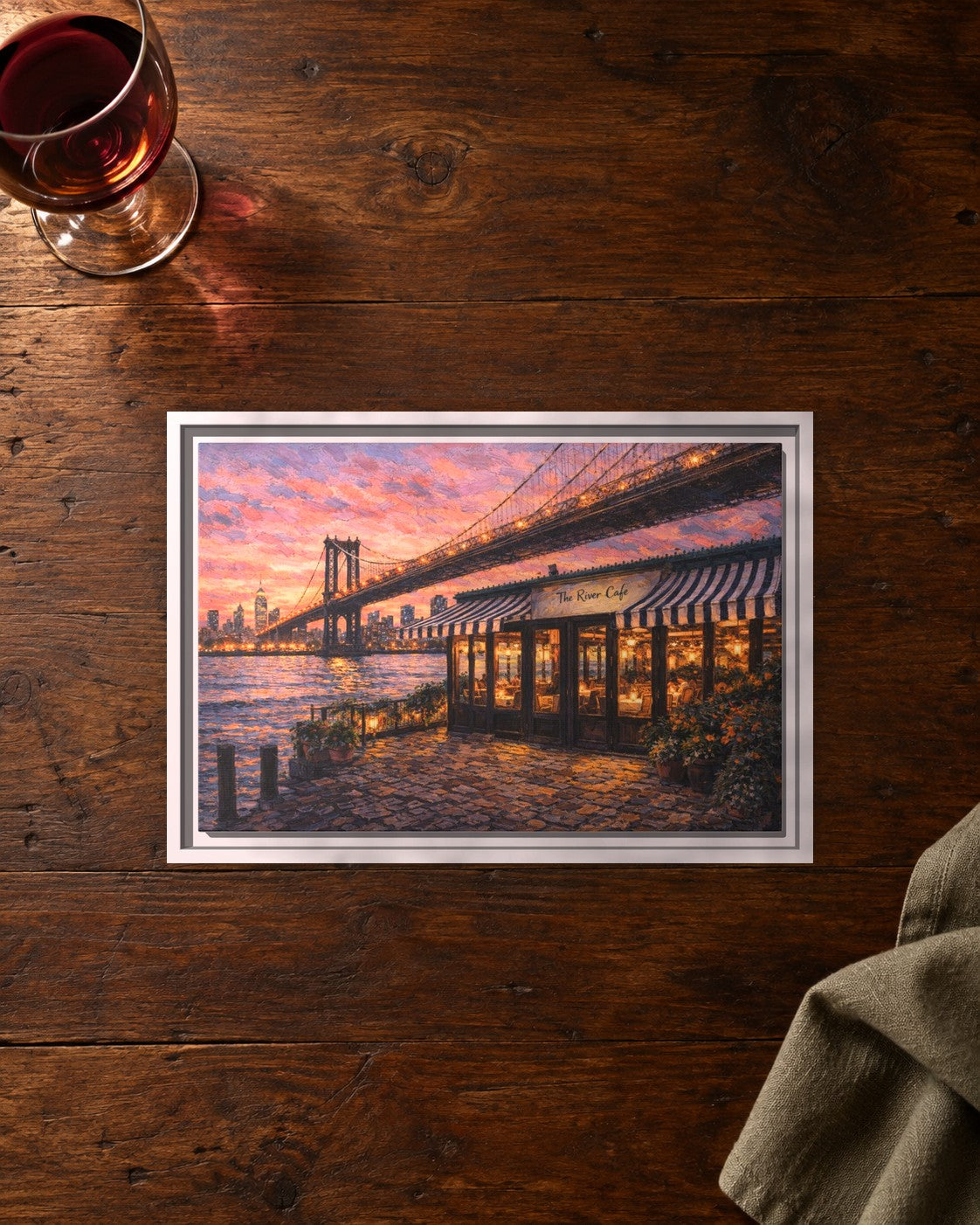 The River Cafe framed canvas print lying on a table