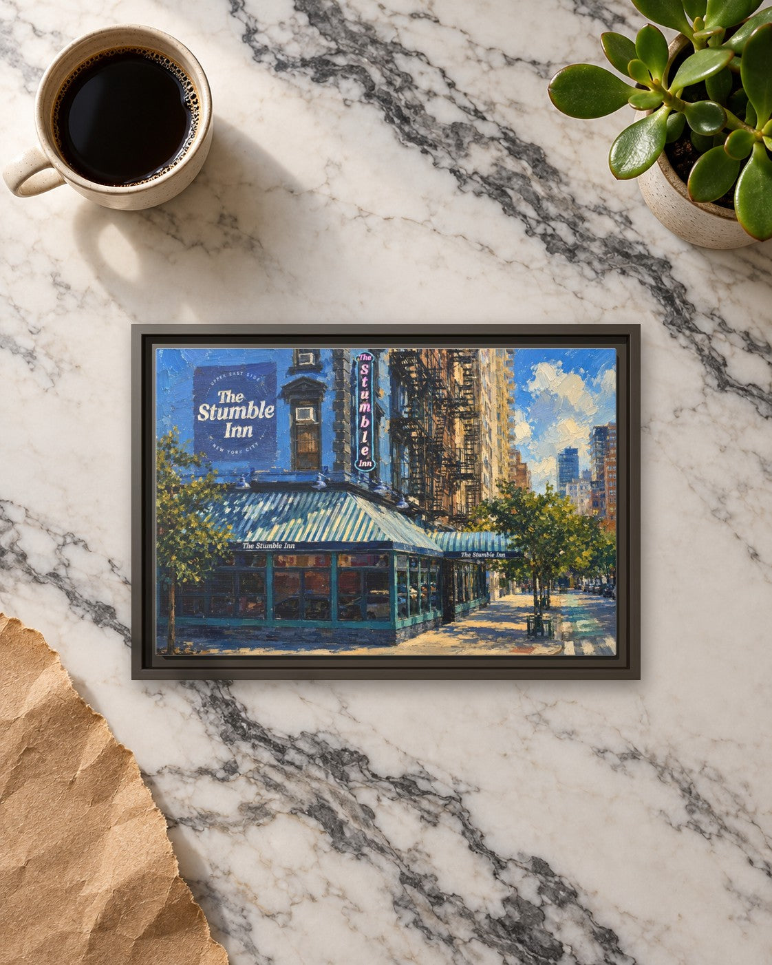 The Stumble Inn framed canvas print lying on a table