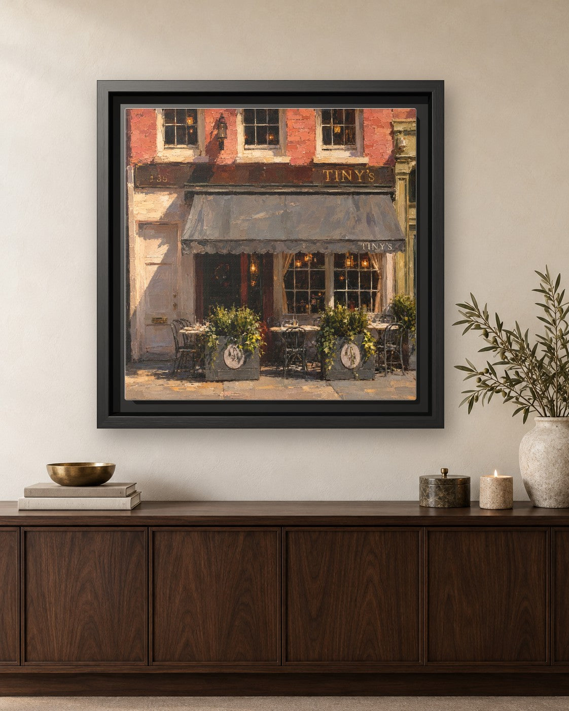 Tiny's & The Bar Upstairs framed canvas print hanging above a credenza
