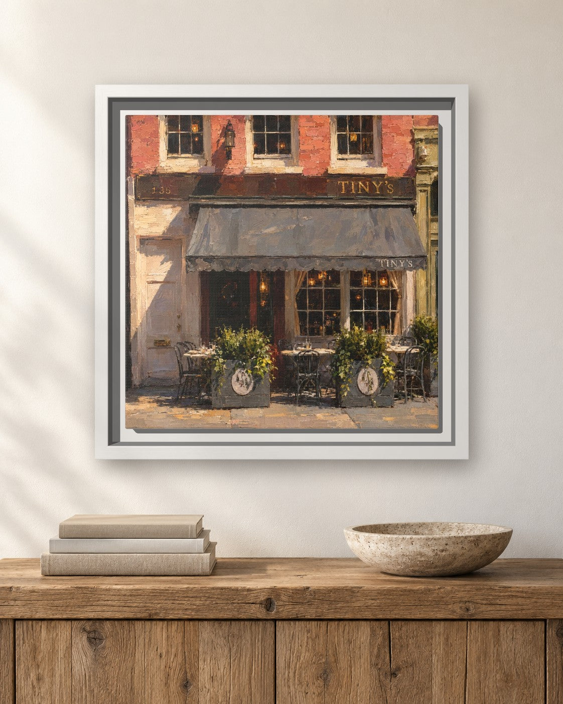 Tiny's & The Bar Upstairs framed canvas print hanging above a sideboard