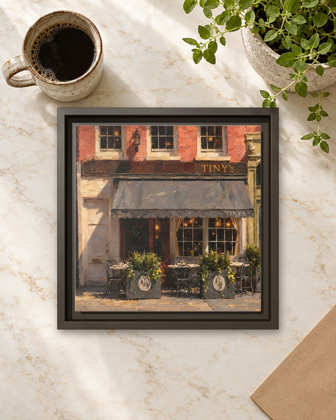 Tiny's & The Bar Upstairs framed canvas print lying on a table