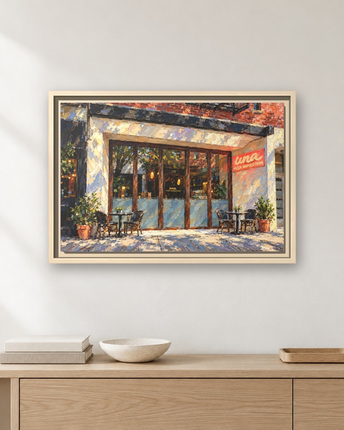 Una Pizza Napoletana framed canvas print hanging above a sideboard